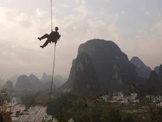Eben abseiling, egg, Yangshuo, China, sky, mountains and river