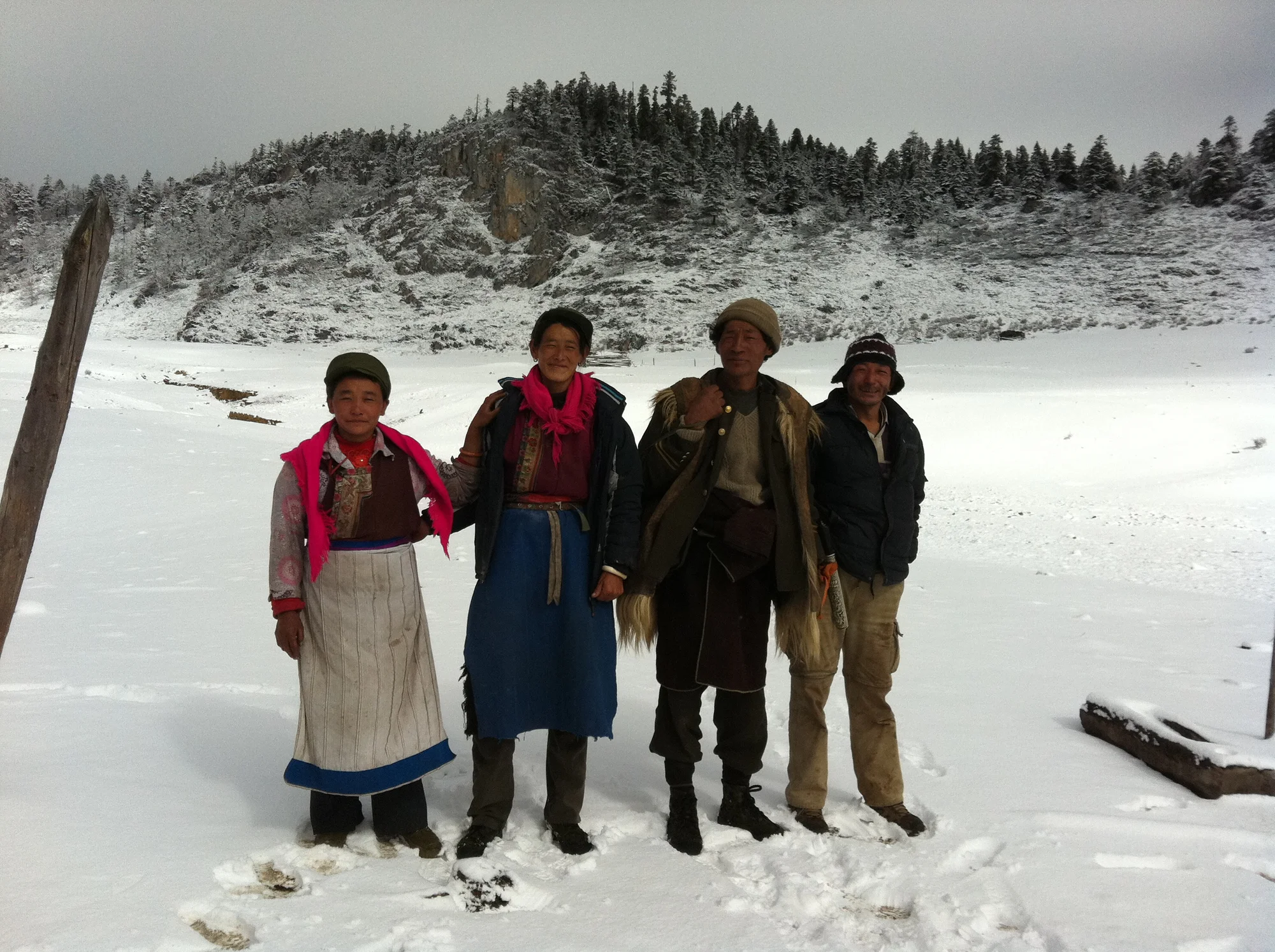 Niru people in the snow, mountains and trees