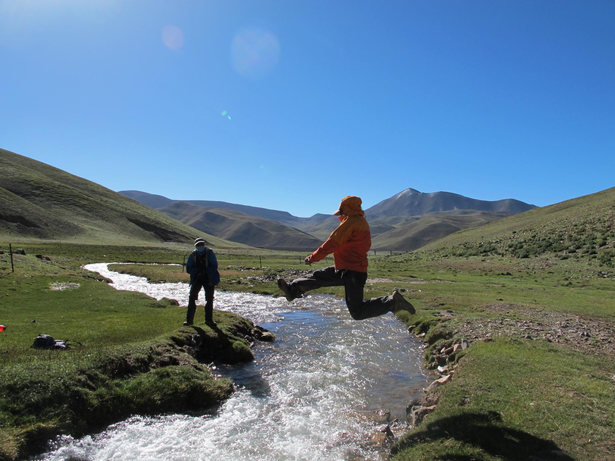 Trekking, river jump, two students, China