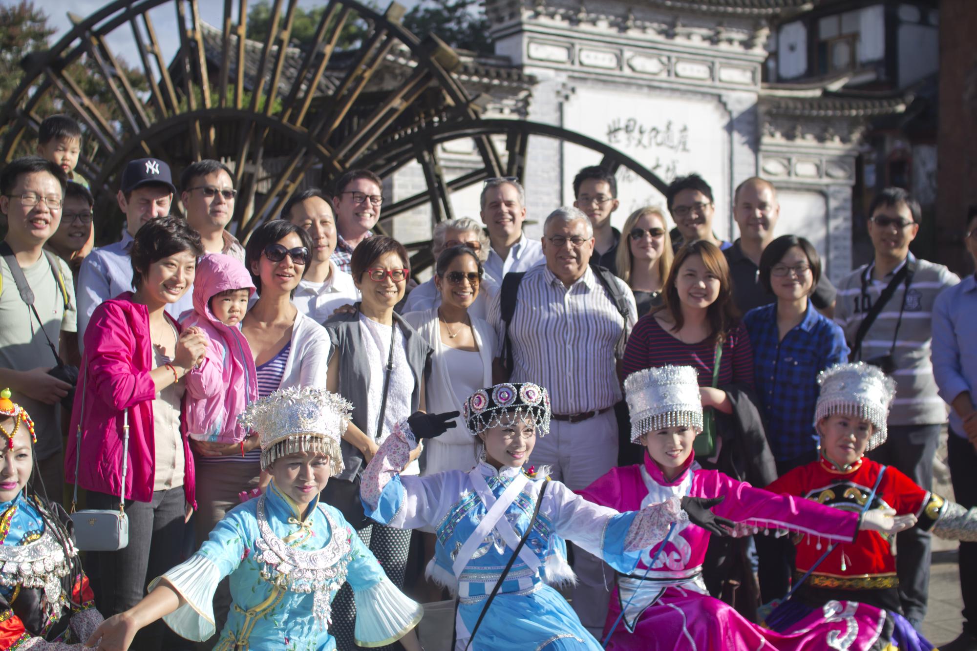 Group photo, Lijiang old town water wheel, local costumes